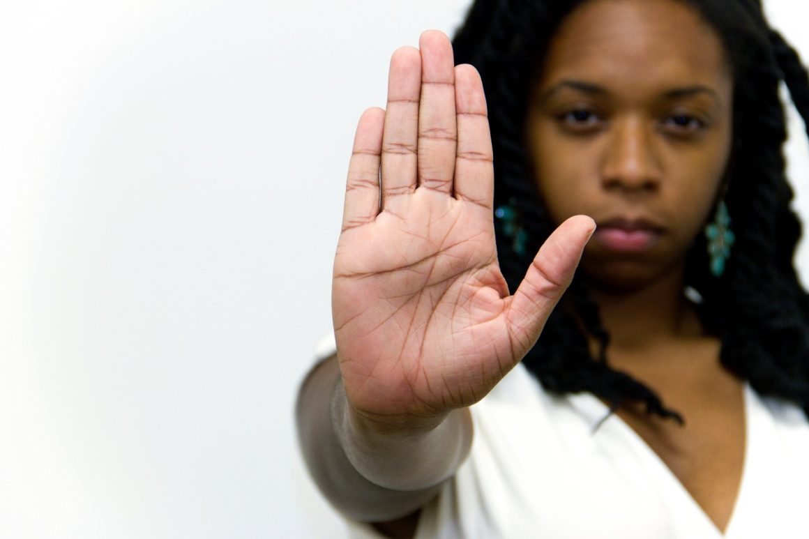 black woman cautioning