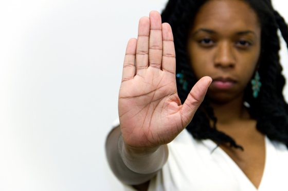 black woman cautioning